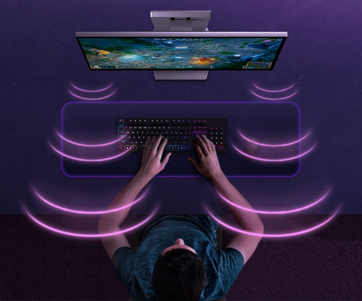 Bird's-eye view of a gamer playing video games with the monitor. Purple sound waves move towards the gamer from the screen.