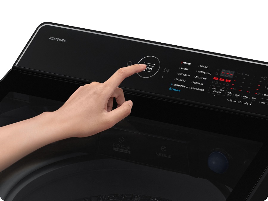 A person is controlling the rear control panel.
