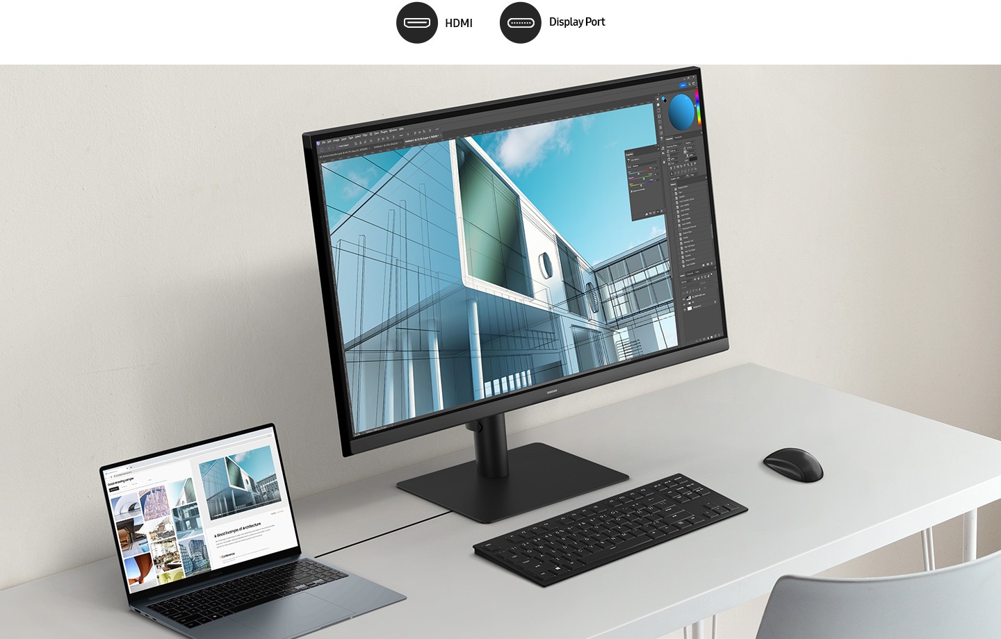 A monitor which supports HDMI and Display Port connected to a laptop, a keyboard, and a mouse are placed on a white desk.
