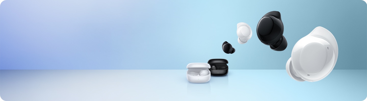 The white Galaxy Buds Core charging case is in front of the black Galaxy Buds Core charging case. Overhead are four Galaxy Buds Core earbuds arranged in alternating black and white colours in the following order black, white, black, white.