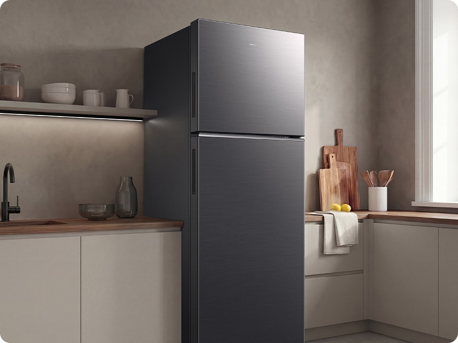 The sleek exterior of the refrigerator gives a clean look to the modern kitchen, with a flat finish.