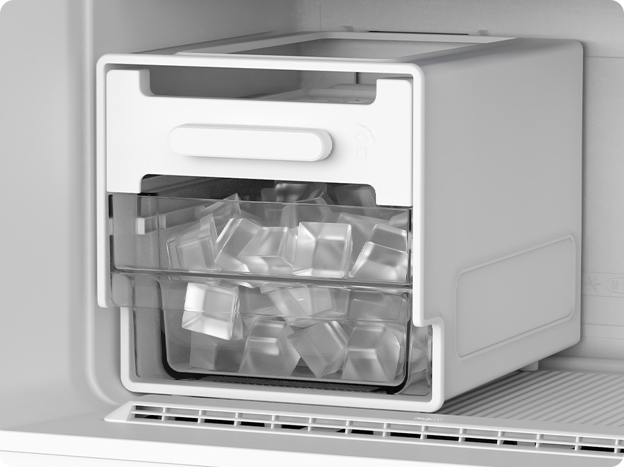 The Movable Ice Maker in the freezer is filled with ice.