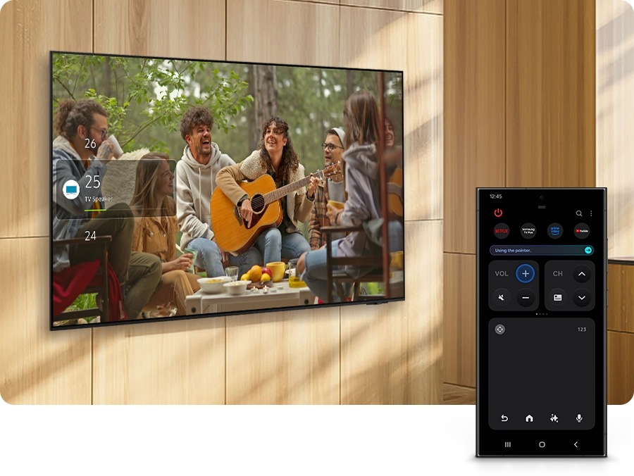 A Galaxy smartphone displays Quick Remote mode, which is used to control a nearby TV.
