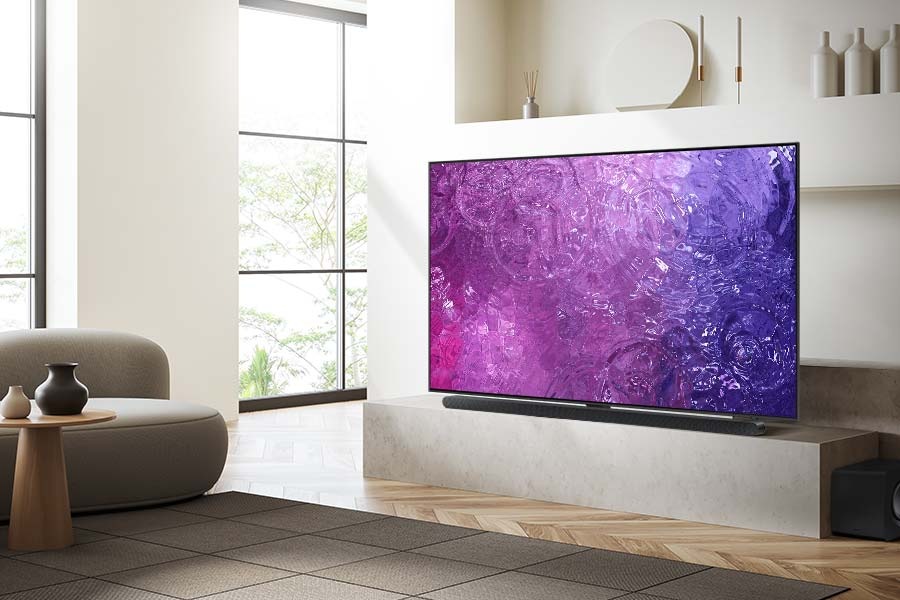 A NEO QLED TV is displaying purple graphic in a room.