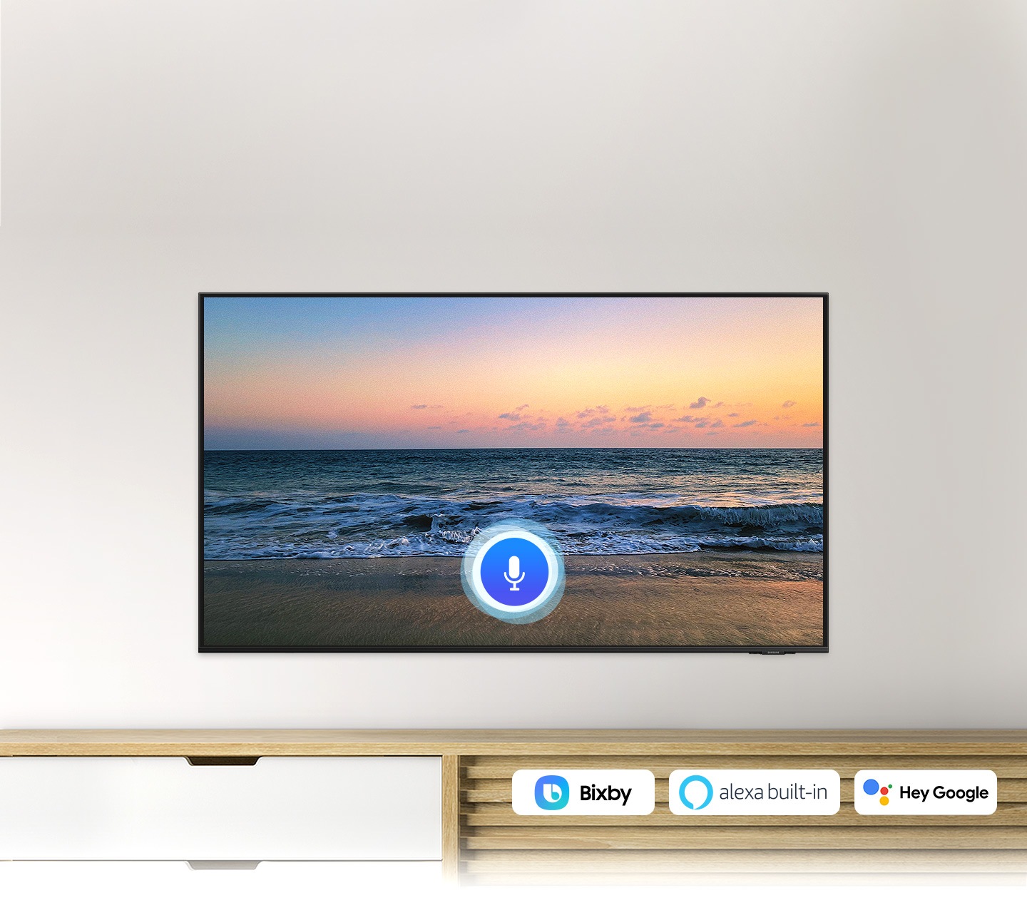 A microphone icon overlays a beach sunset TV screen image, demonstrating UHD TV voice assistant feature.