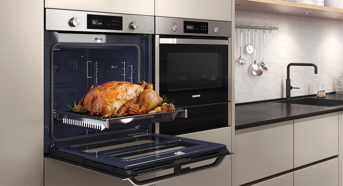 Shows a roast chicken sliding out of the oven on the Telescopic Rail.