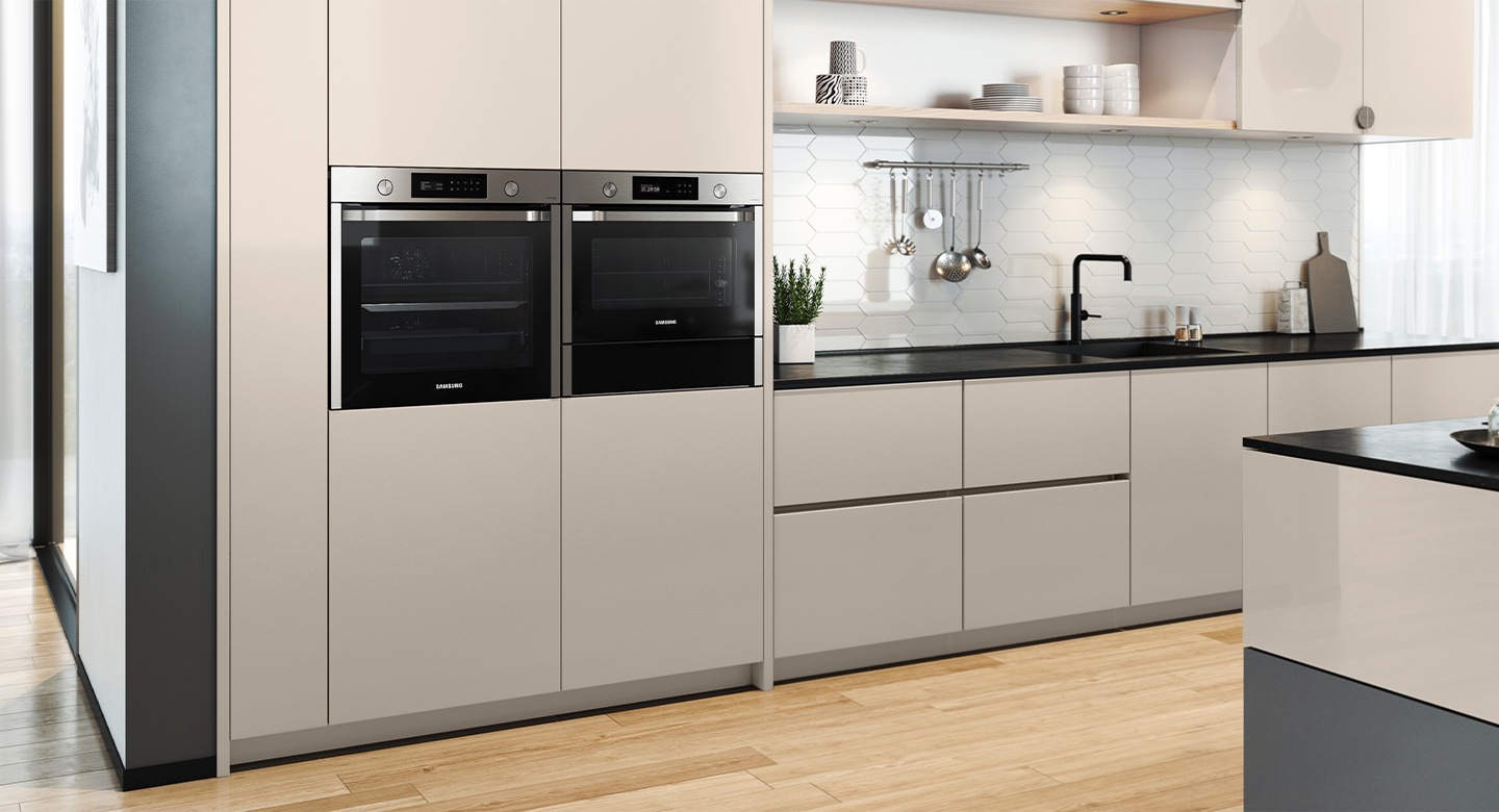 Shows the oven installed in a kitchen next to a †Dual Cook' oven.