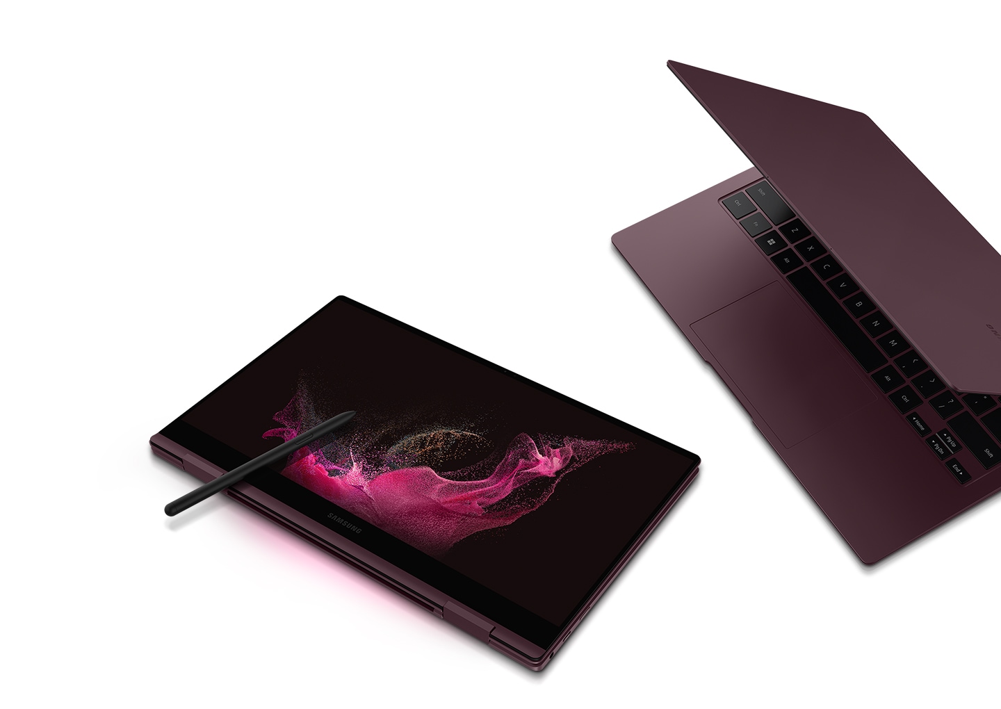 Two burgundy-colored Galaxy Book2 Pro 360 devices are next to each other. The one on the left is folded like a tablet and an S Pen is placed on the screen that has a pink wavy wallpaper. The one on the right is half open and is facing towards the Galaxy Book2 Pro 360 on the left.