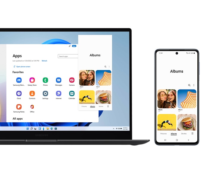 A Galaxy laptop and Galaxy smartphone are shown side by side. The laptop shows the Apps window, which displays all the apps downloaded on the smartphone. The Albums app is also opened and shows that the user could access the app just as he or she would on the smartphone. On the smartphone screen, The Albums app is also opened and shows various pictures of women and food etc.