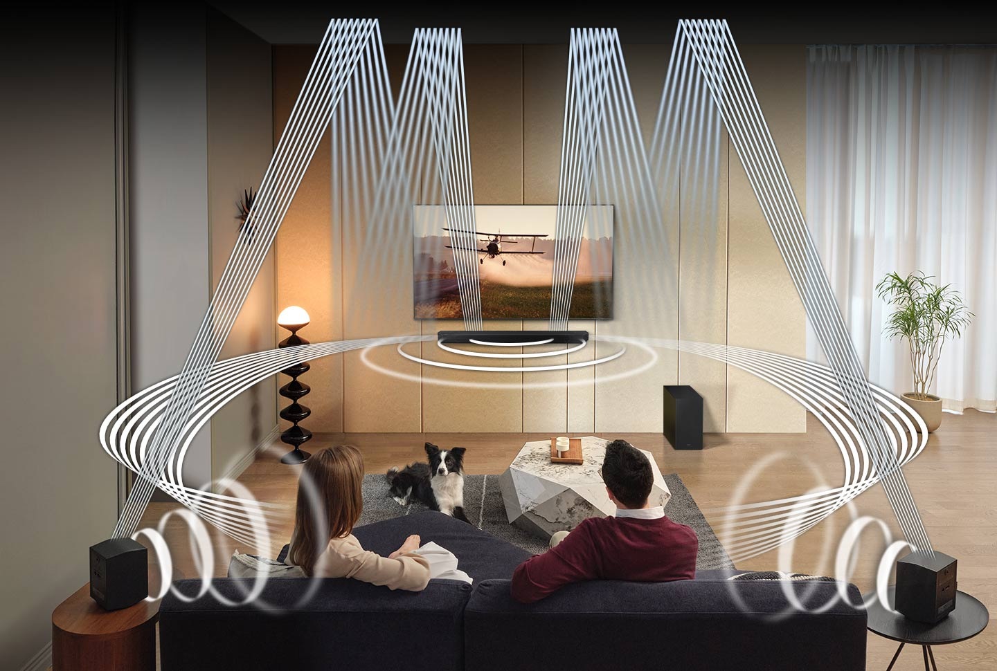 A man and woman are surrounded by sound waves that come out of the Q930C's front, side, rear and up-firing speakers.