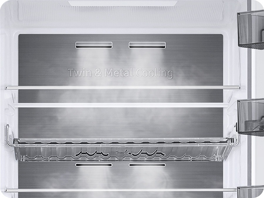 The Metal Cooling plates inside the refrigerator look extremely cold and the cold air flows around.