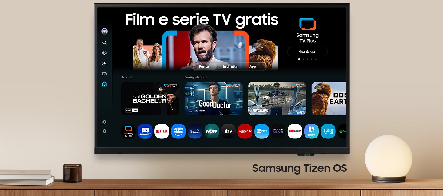 A wall-mounted TV shows popular apps and curated content on the home menu. "Samsung Tizen OS"