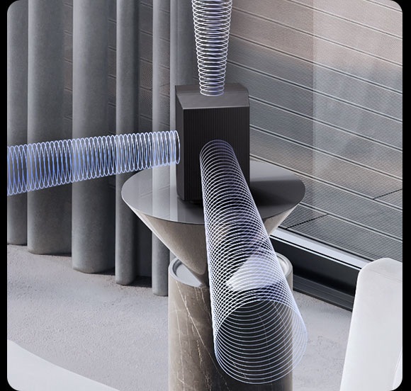 Sound waves shoot out from a rear speaker's front-, side- and up-firing speakers in a living room setting.