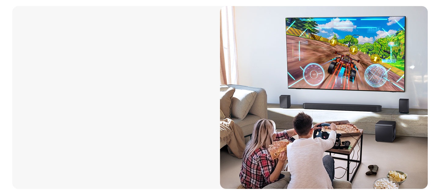 Two people enjoy an immersive 3D-like gaming experience with Game Pro mode on their Samsung soundbar.