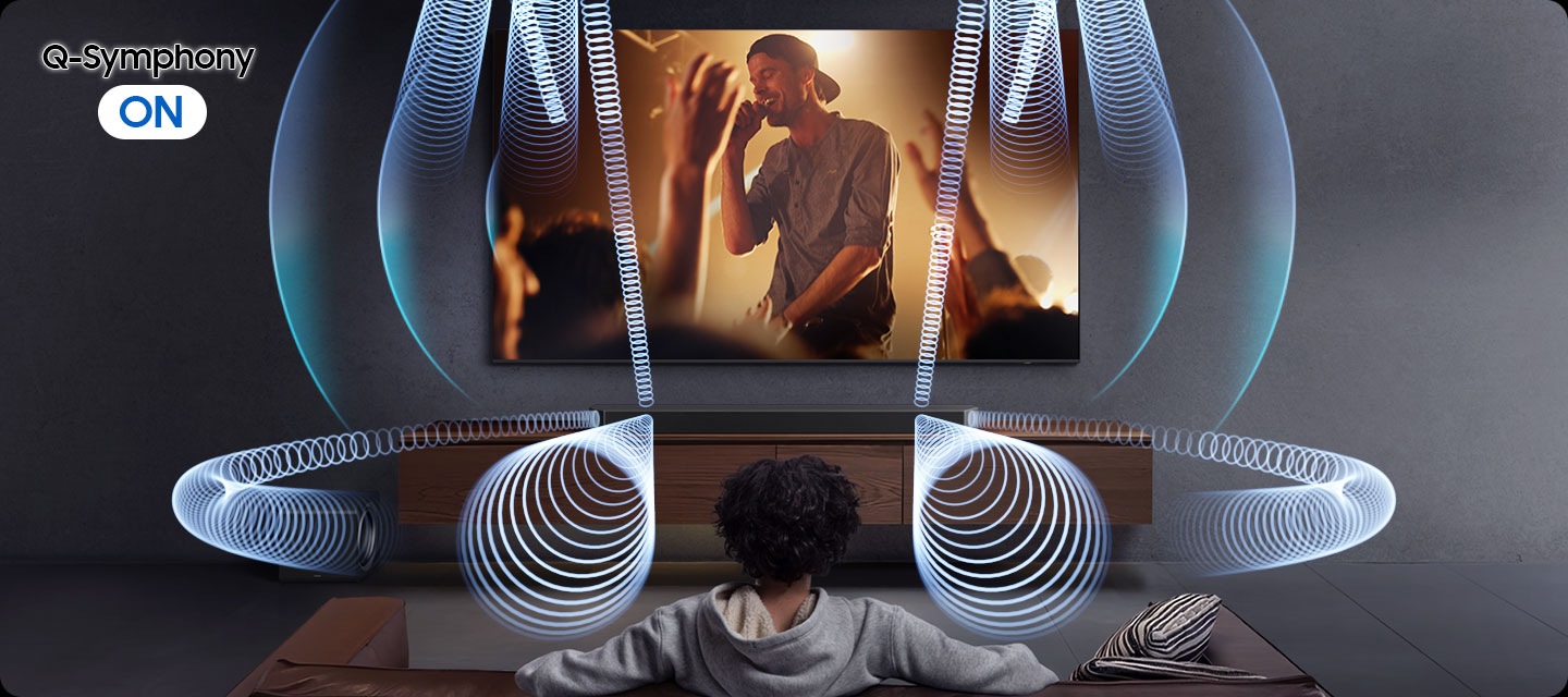 Man watches TV in living room with a soundbar and subwoofer. The screen depicts lively concert scene. With Q-Symphony OFF sound waves emanate from the soundbar in different directions. With Q-Symphony ON, sound waves also emanate from the TV, indicating that soundbar and TV play sound together.