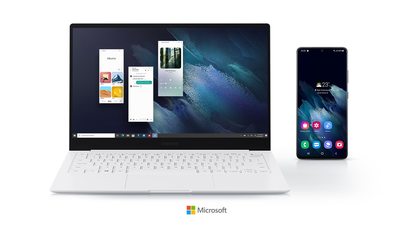 Three Android apps are being run on the Galaxy Book Pro by using Your Phone app. A mobile phone is displayed right next to the laptop, showing that the two devices are connected. A logo of Microsoft is placed below the devices.