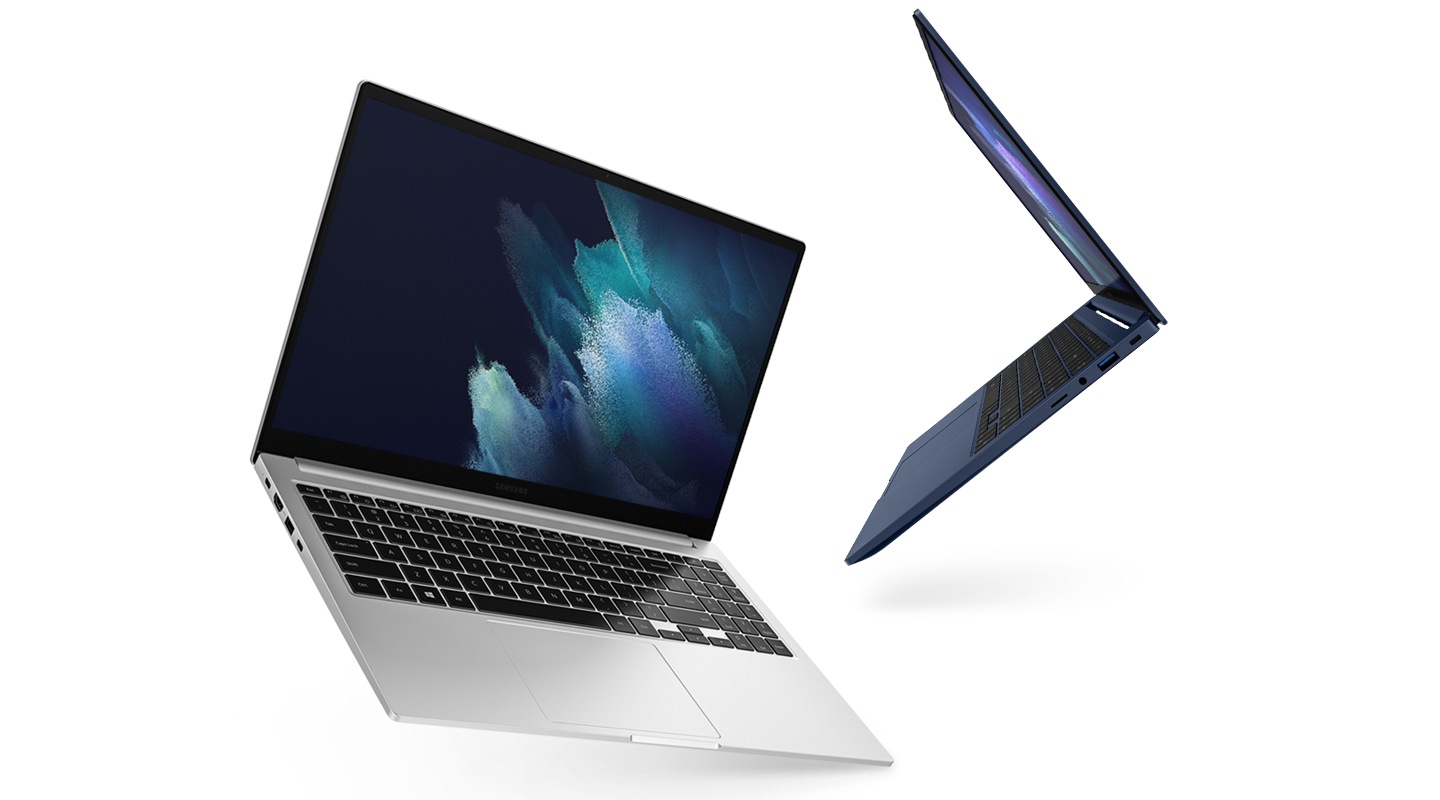 Two Galaxy Book's are placed, with Mystic Silver showing the display and keyboard while the Mystic Blue one in the back facing left completely, highlighting its thin profile.