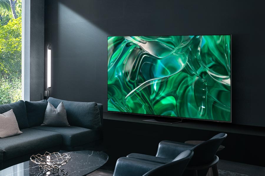 OLED is displayed in a dark living room.