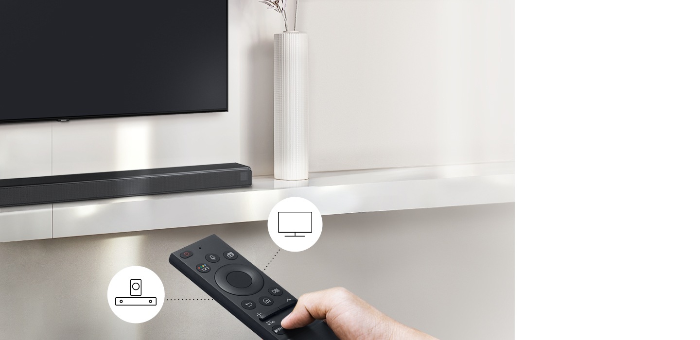 A user controls both soundbar and TV functions with Samsung TV remote.