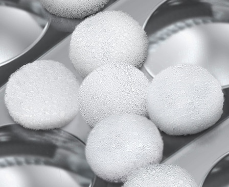 Bubbles are formed through the bubble holes within the washing machine's drum.