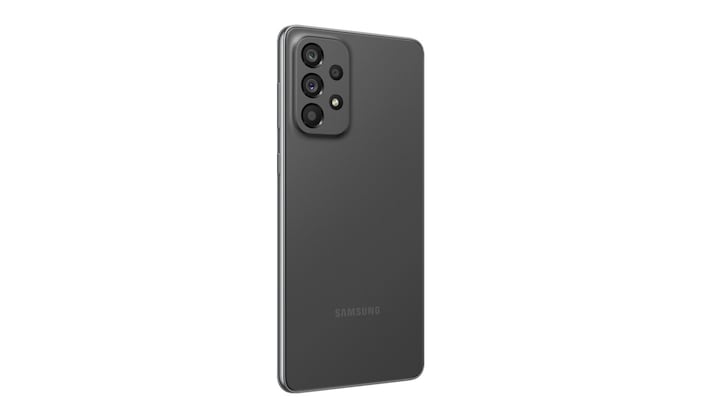 2. Galaxy A73 5G in Awesome Gray seen from the front with a colorful wallpaper onscreen. It spins slowly, showing the display, then the smooth rounded side of the phone with the SIM tray, then the matte finish and the minimal camera housing on the rear and comes to a stop at the front view again.