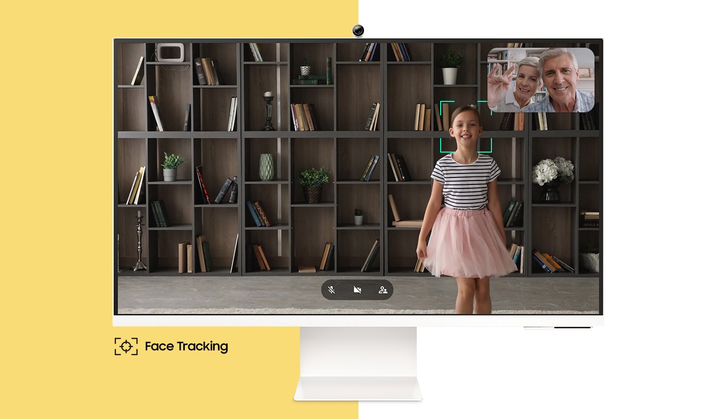 On the monitor screen, a girl is dancing, and in the upper right corner of the screen, her grandparents are smiling. There is a square mark around the girl's face, which also moves as she moves. And below the monitor, the text †Face Tracking' appears with its icon.