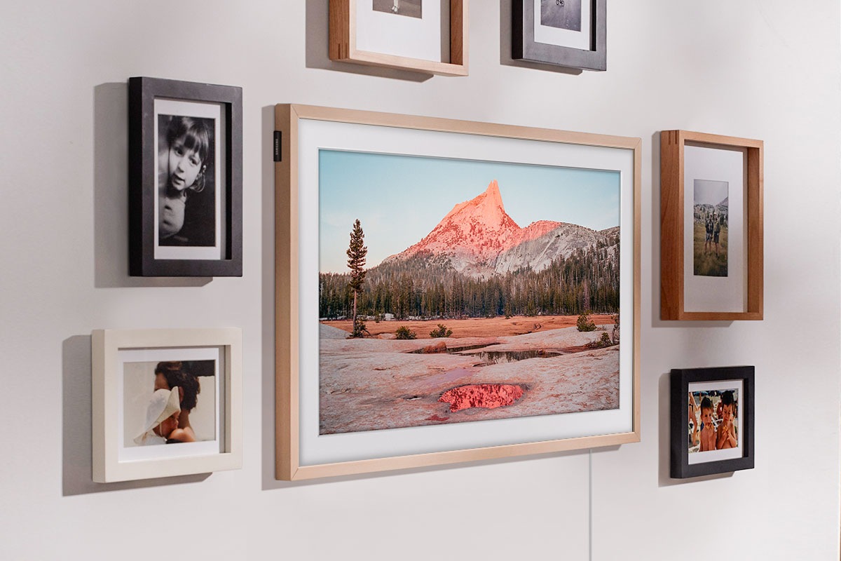 The Frame is hanging on a wall via a Slim Fit Wall Mount to look like a real picture frame. 