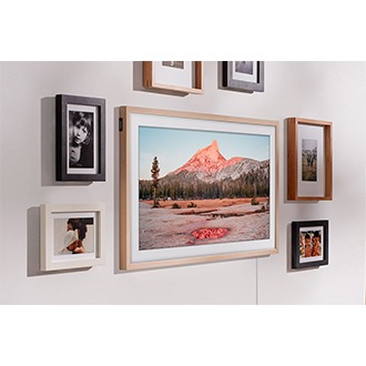 The Frame is hanging on a wall via a Slim Fit Wall Mount to look like a real picture frame. 