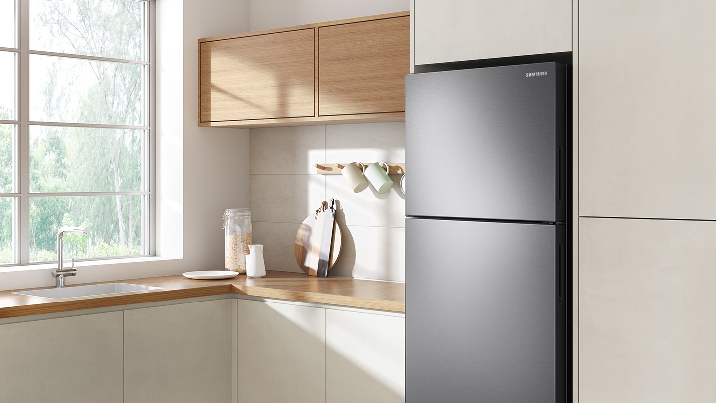 The sleek exterior of the fridge gives a clean look to the modern kitchen, with a flat finish.