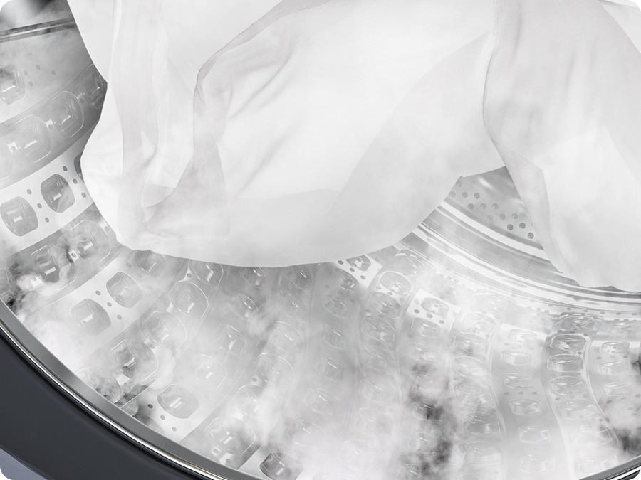 El vapor se dispersa dentro de la lavadora y la ropa se remoja en el tambor. El vapor se dispersa dentro de la lavadora y la ropa se remoja en el tambor.