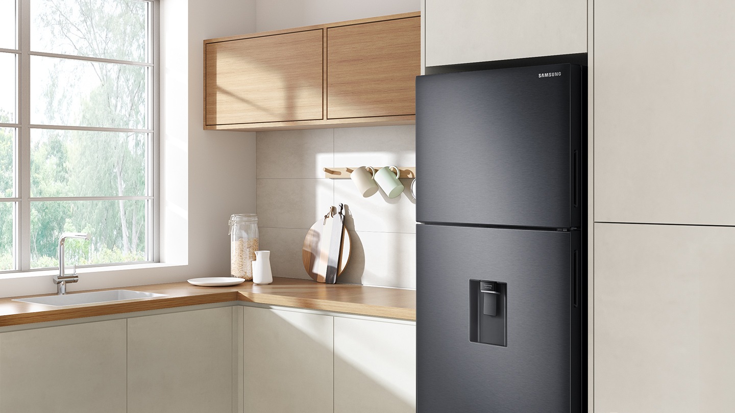 The sleek exterior of the fridge gives a clean look to the modern kitchen, with a flat finish.