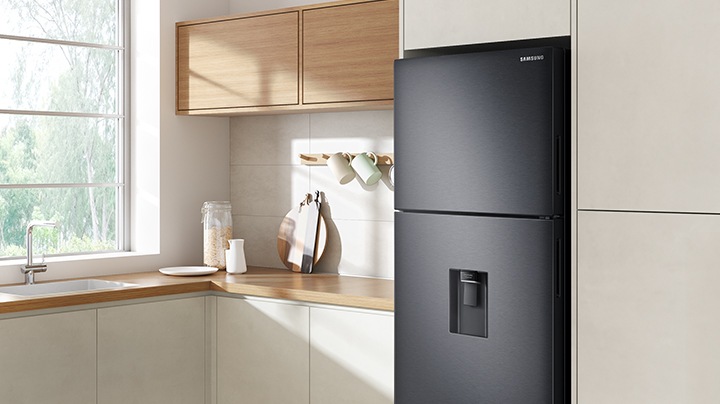 The sleek exterior of the fridge gives a clean look to the modern kitchen, with a flat finish.
