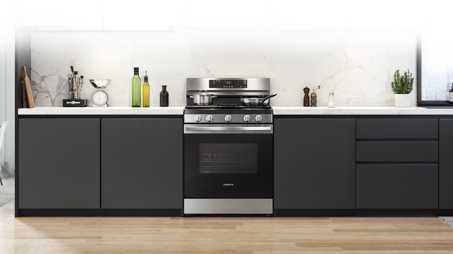 Shows a modern kitchen with the stylish, stainless steel oven fitting neatly into the design.