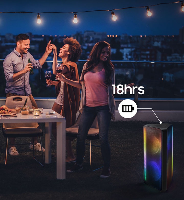 People are having a party on the rooftop with Sound Tower. Built-in battery signifies Sound Tower can last for 18 hours.