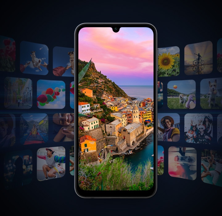 A Galaxy A24 is showing a scenic shore area in a full screen. In the background, many screenshots of photos, games and videos are shown to emphasize the large capacity of the storage.