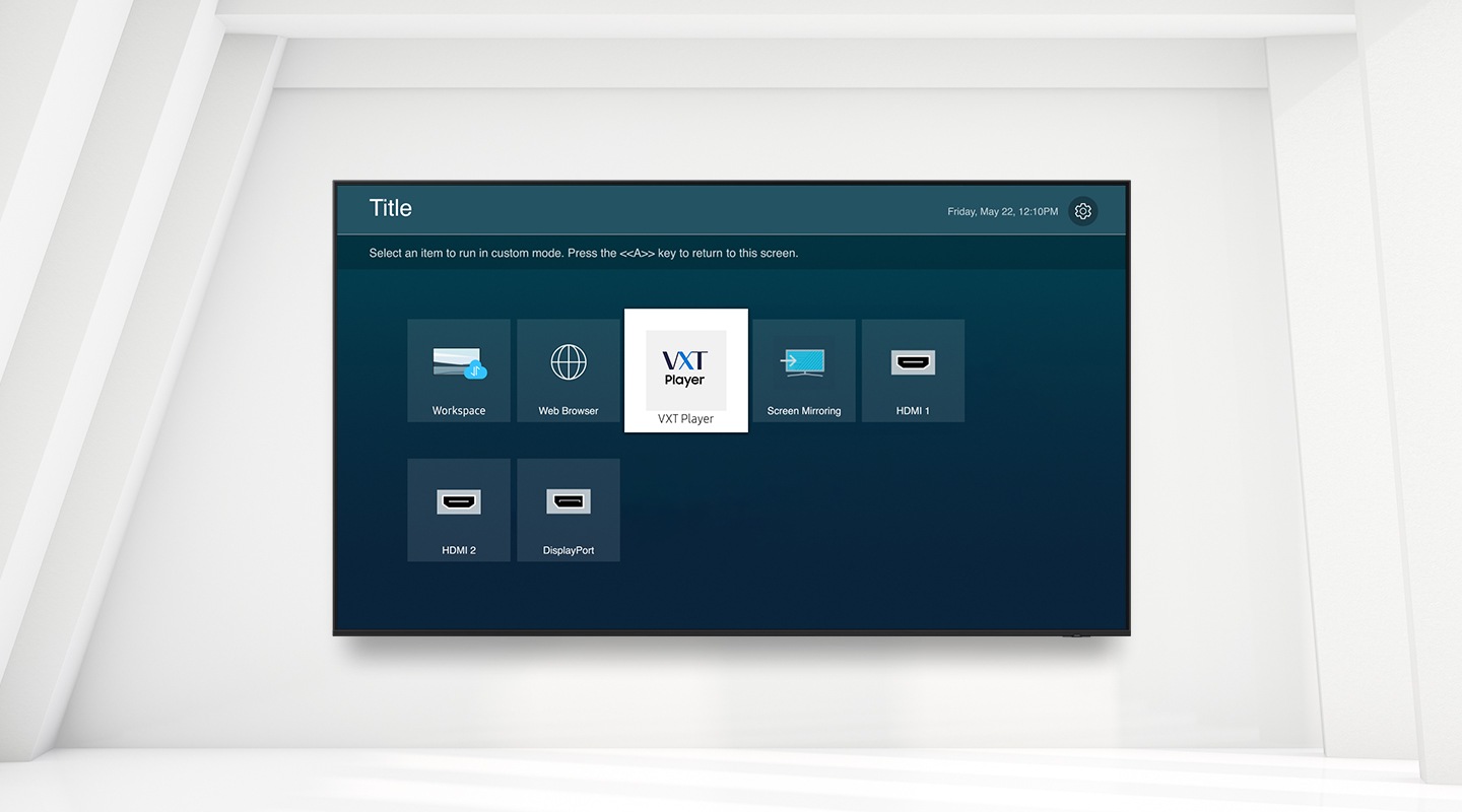 The image shows a digital screen displaying a menu with various icons for functions like "Workspace," "Web Browser," and different input sources. The "VXT Player" icon is highlighted, indicating it has been selected.