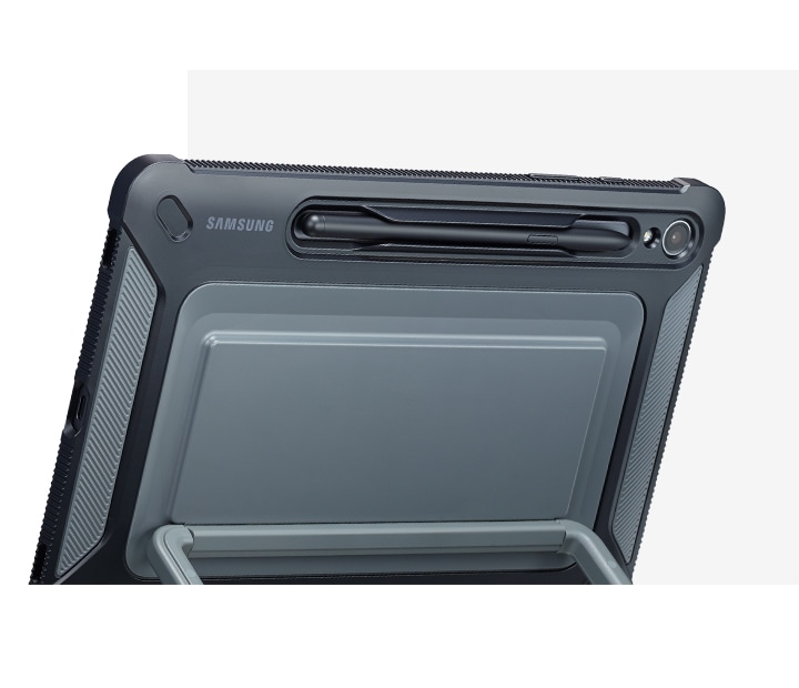A back view of Galaxy Tab S9 covered with an Outdoor Cover, propped up using the kickstand and showcasing the S Pen holder.