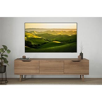 Crystal UHD DU7000 is displaying picture with green hills in the living room.