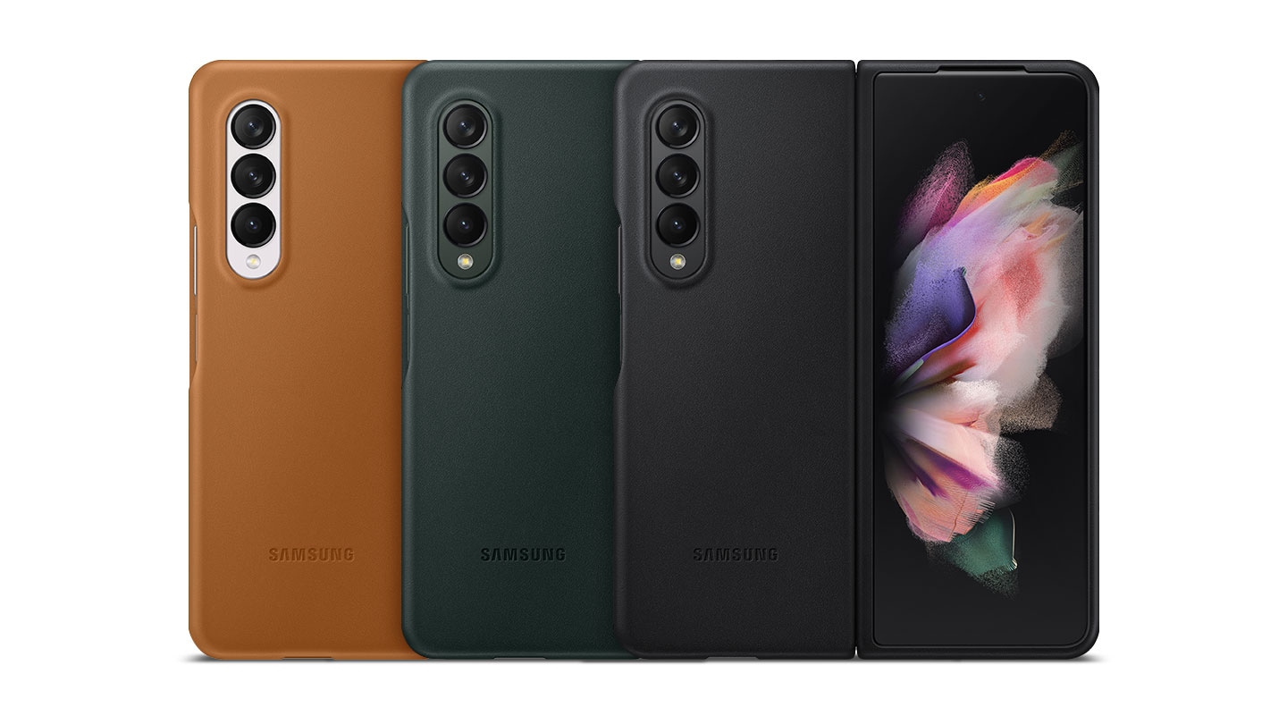 Three Galaxy Z Fold3 5G phones unfolded and seen from the rear, each with the Leather Cover installed.