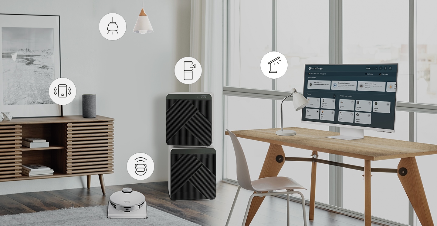 A room contains a desk with a smart lamp and monitor on top, smart air cleaner, a smart robot vacuum, a smart hanging light and a smart speaker. Above each smart home item is an icon representing each item. Each icon is selected using SmartThings functionality which turns on each device.
