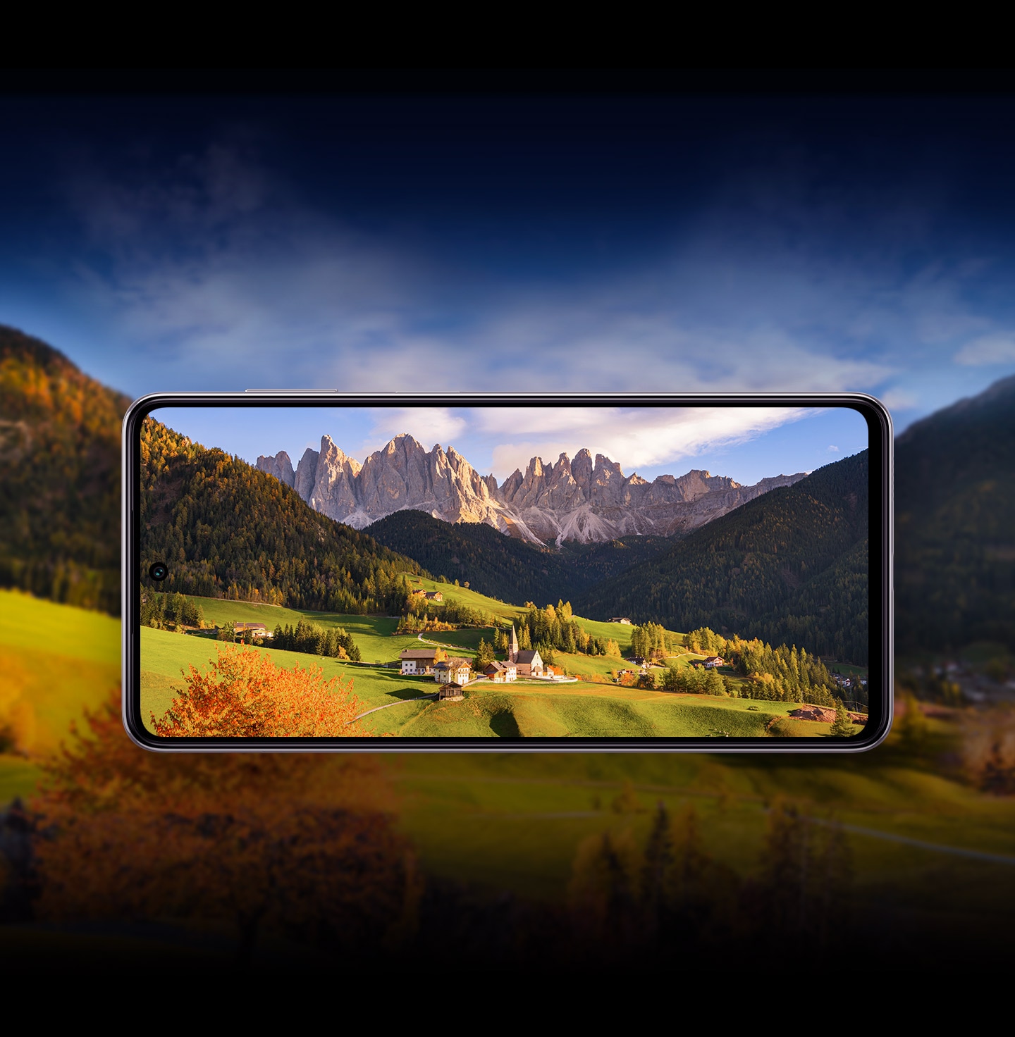 A scenic landscape of mountains, fields and a small village. At the center, a Galaxy M54 5G frame holds the village and some of the scenery.