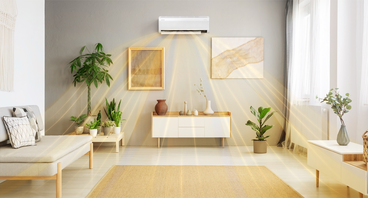 Shows a wall-mounted air conditioner dispersing warm air quickly across a room.