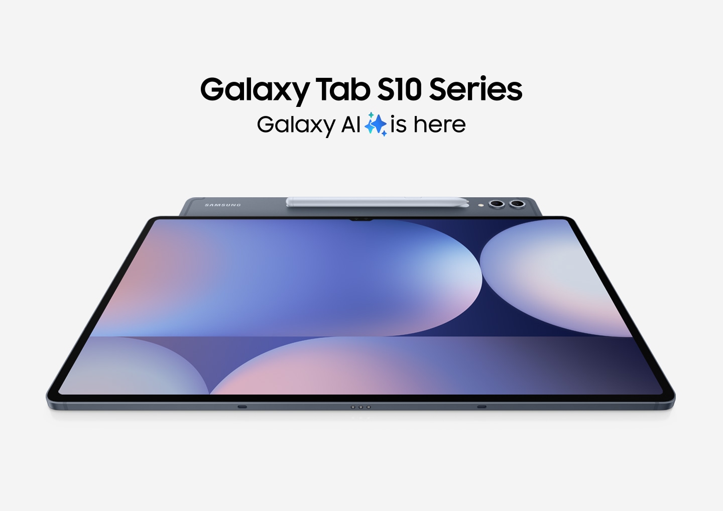 A Galaxy Tab S10 Series device angled to show its rear camera and S Pen, is placed under another Tab S10 device facing up with a colorful wallpaper on display. Text reads Galaxy Tab S10 Series. Galaxy AI is here.