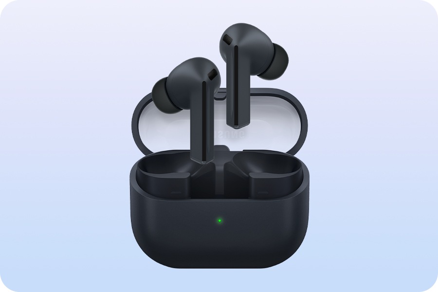 A pair of Black Galaxy Buds3 FE earbuds hovering above the open Galaxy Buds3 FE case.