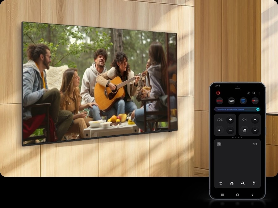 A Galaxy smartphone displays Quick Remote mode, which is used to increase the volume of a nearby TV as it shows a scene of a woman playing guitar.