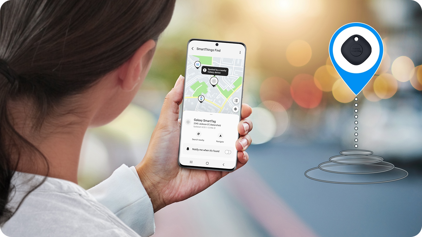 A woman checking mobile app that's linked to Galaxy SmartTag to retrace her stuff; App shows location where it can be found