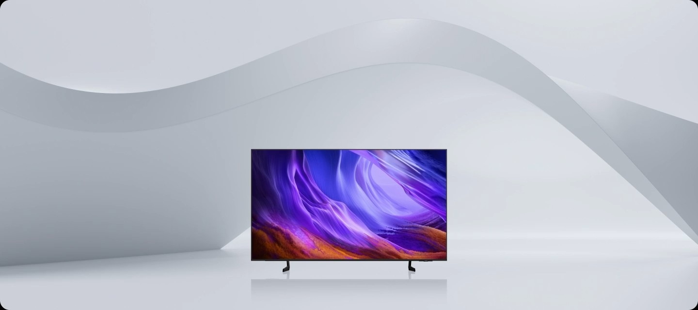 Front view zoom-in on a Samsung OLED TV, then shifts to a side angle to highlight its sleek, refined contour design.