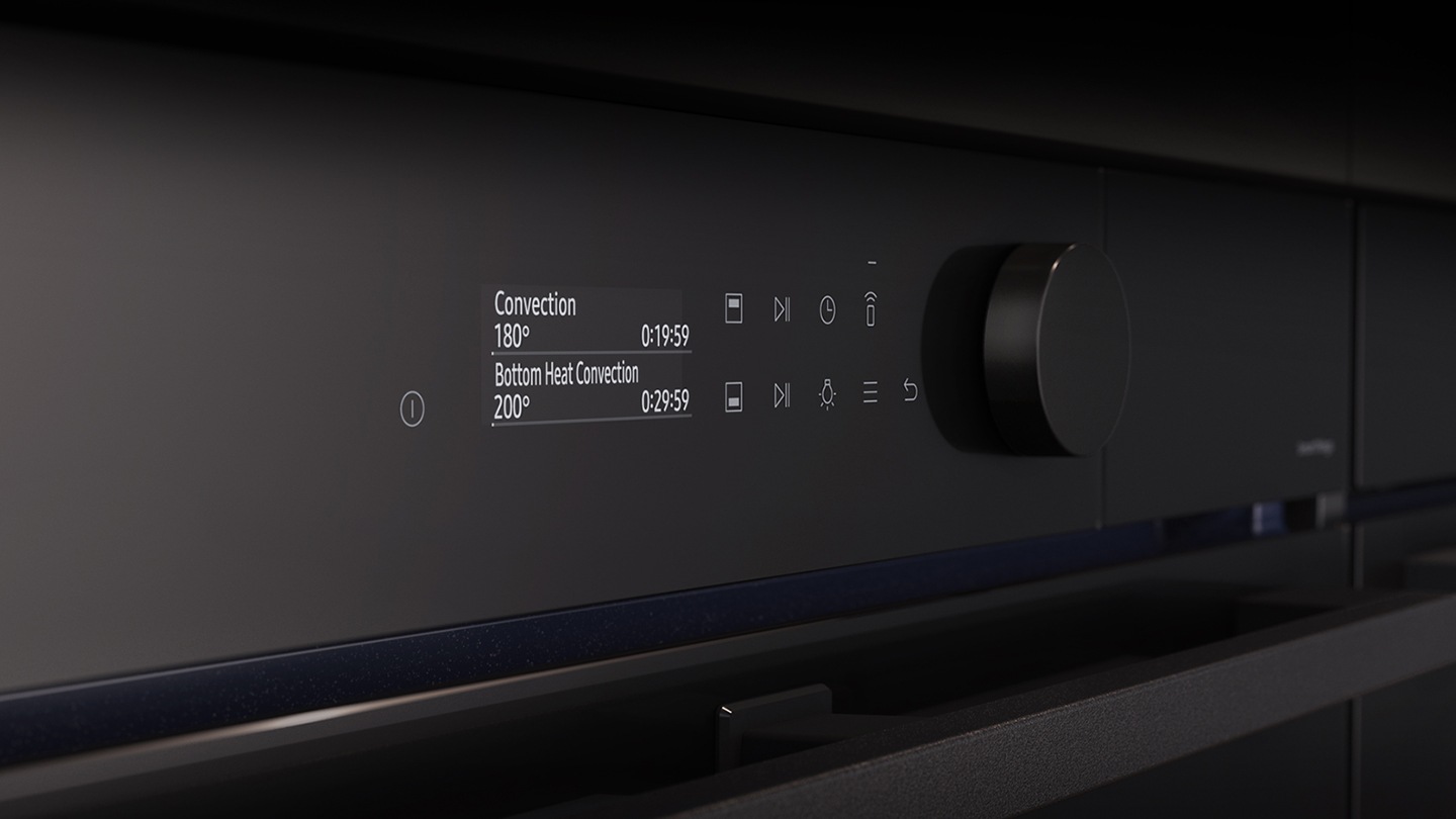 Shows a close-up of the oven's stylishly minimalist control panel with an LCD display, which shows pictures of the various cooking options, touch control and a single knob.