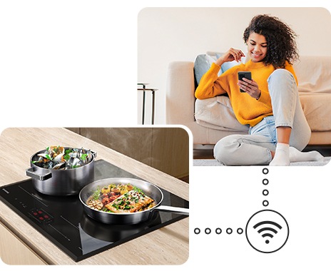 Two pots with delicious food are boiling on the cooktop, and a woman is monitoring the cooktop status remotely near the sofa via the SmartThings app on her smartphone.