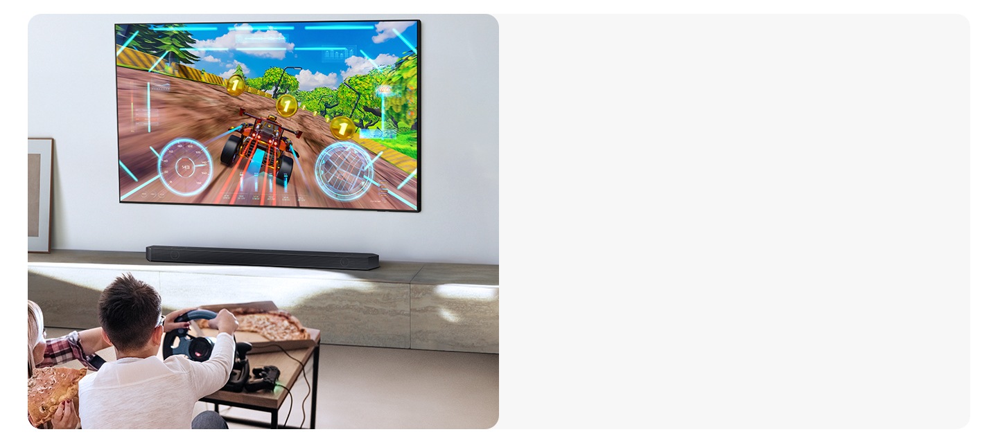Two people enjoy an immersive 3D-like gaming experience with Game Pro mode on their Samsung soundbar.